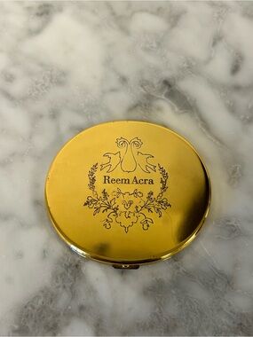 Reem Acra • branded golden compact mirror (Vintage)